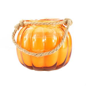 The Glass Pumpkin Lantern is an orange pumpkin-shaped glass jar with a rope handle, perfect as a Halloween lantern to add festive charm to any space. Shown against a white background.