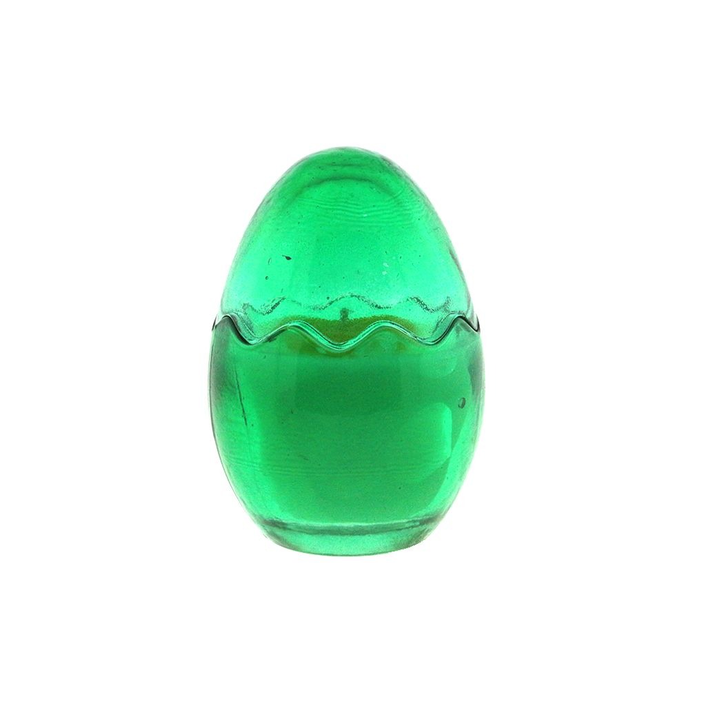 The Green Glass Easter Egg w/ Yoke is an egg-shaped candle crafted from natural wax with a wavy seam around the middle, shown on a white background.