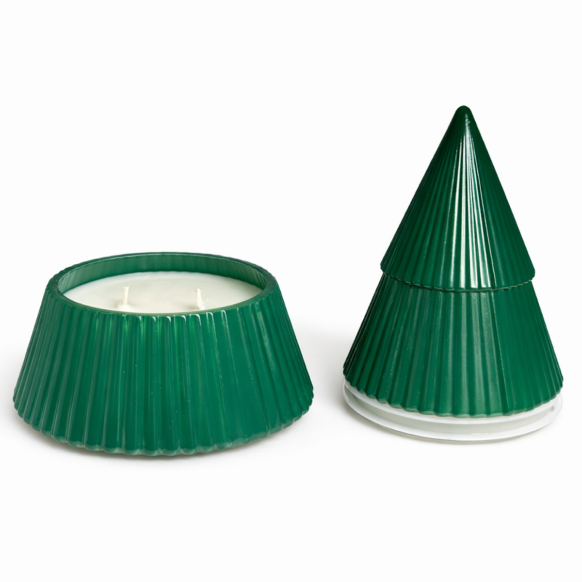 Two green, ribbed, conical Green Ceramic Christmas Tree Candles are shown—one open to reveal a hand-poured three-wick candle inside, the other closed with its pointed lid—a perfect decorative keepsake.