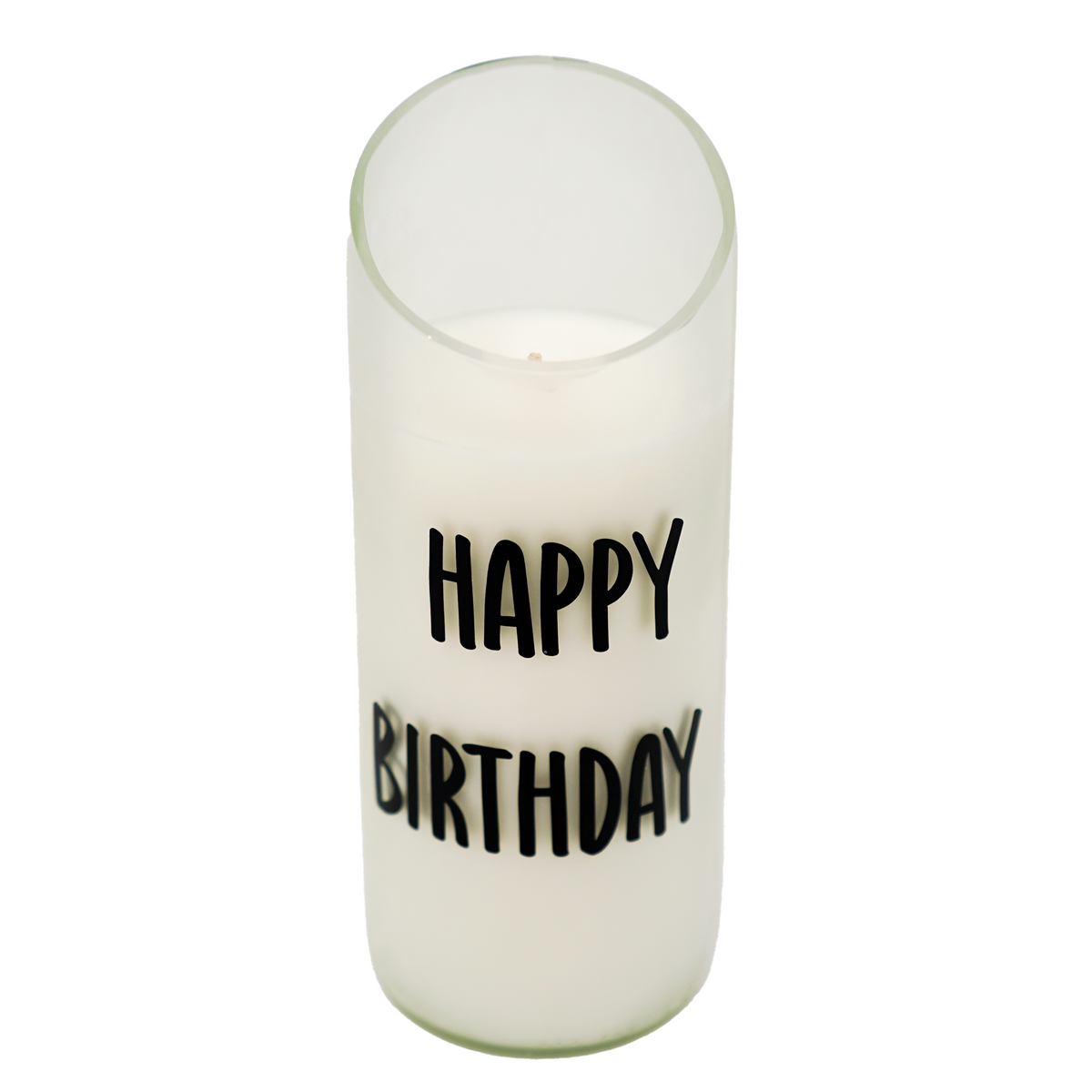 The "Happy Birthday" Recycled Curve Cut Candle is a white natural wax candle in a recycled wine bottle glass, printed with "Happy Birthday" in black on the front.