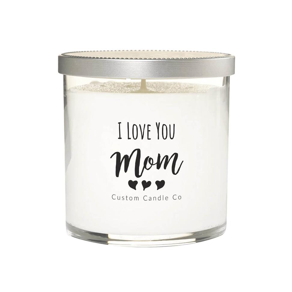 The "I Love You Mom" White Glass Candle features white soy wax in a clear jar with a silver lid. The label displays three hearts and "Custom Candle Co"—a perfect custom gift to express your love to mom.