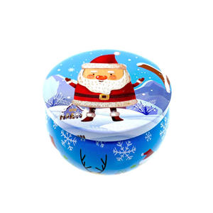 Festive blue tin with snowflakes and a Santa lid, set in a snowy scene—ideal for gifting the Blue Santa Holiday Tin Candle – Pine Forest Scent, made from premium soy wax.