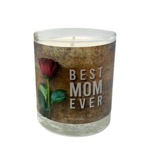 The Best Mom Ever quoted candle with box features a label with a red rose and "BEST MOM EVER" text on a brown background. Crafted from soy wax, it offers a soothing amber scent to fill any space with comfort.