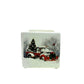 The Mini Square Christmas Candle (Snow Design) features a white ceramic holder with festive red trucks, a Christmas tree, and snowy trees—perfect for filling your home with holiday sparkle scent this season.