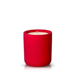 The Intention Red Candle features a red cylindrical holder with a white soy wax candle inside, displayed against a plain white background.