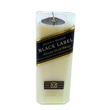 The Recycled Black Label Whiskey Candle is a white candle shaped like a rectangular bottle, made from upcycled whiskey bottles and wrapped with a Johnnie Walker Black Label 12 Years label.