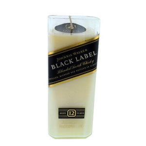 The Recycled Black Label Whiskey Candle is a white candle shaped like a rectangular bottle, made from upcycled whiskey bottles and wrapped with a Johnnie Walker Black Label 12 Years label.