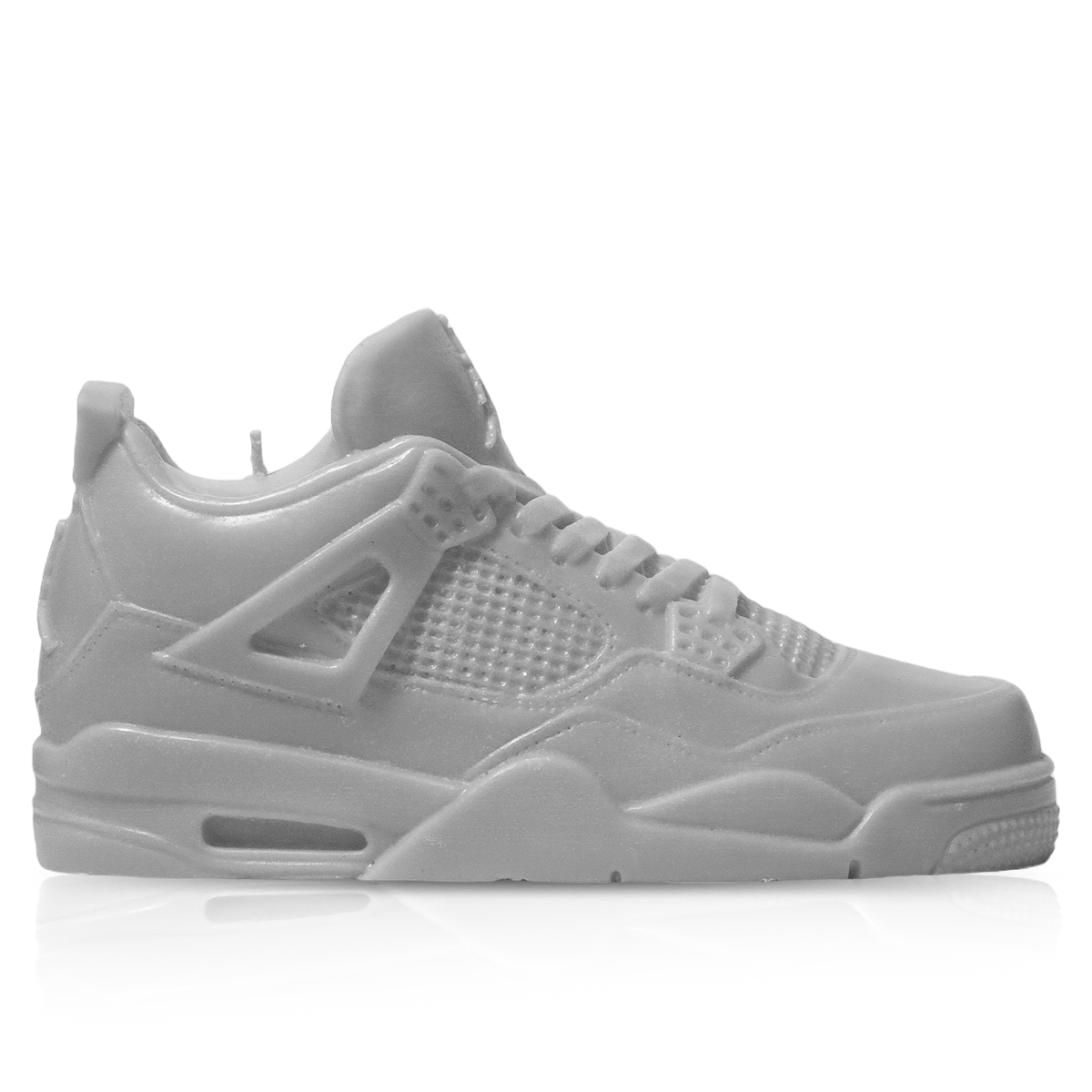 The Jordan 4 Large Sneaker Candle (On Backorder) is a hand-poured, monochromatic gray candle shaped like the iconic sneaker, shown in profile on a white background.