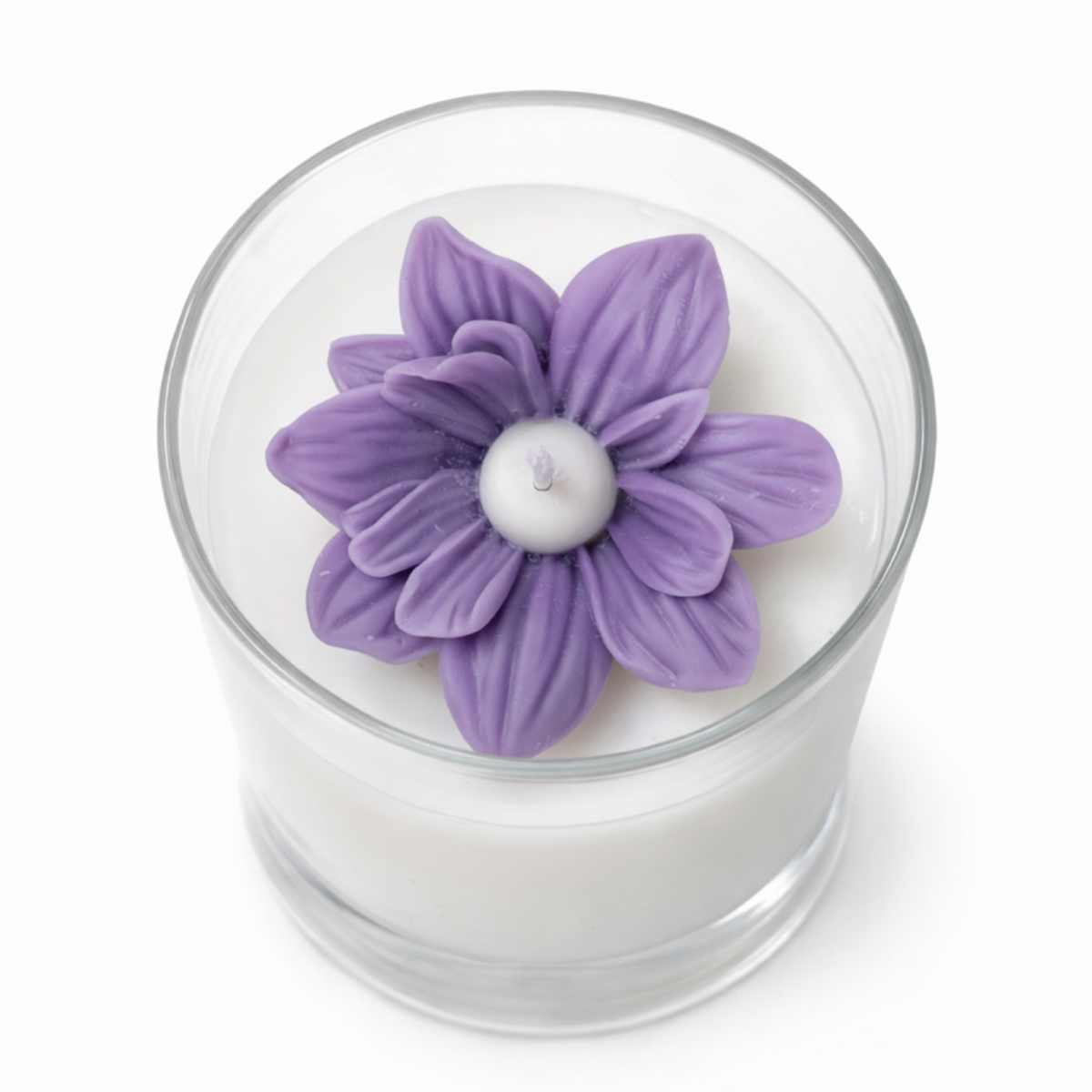 Candle with a purple flower-shaped candle top on a white background