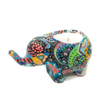The Mardji the Ceramic Elephant Candle is a vibrant, patterned ceramic elephant candle holder featuring an all-natural soy citronella candle on its back.