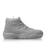 The Jordan 11 Medium Sneaker Candle (On Backorder) is a gray, hand-poured candle shaped like an athletic shoe, shown in profile against a plain white background.