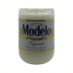 The Recycled Especial Beer Candle is a white hand-poured candle in a glass container made from a recycled Modelo Especial bottle with the original label, offering a unique and sustainable candle choice.