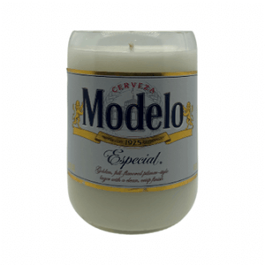 The Recycled Especial Beer Candle is a white hand-poured candle in a glass container made from a recycled Modelo Especial bottle with the original label, offering a unique and sustainable candle choice.