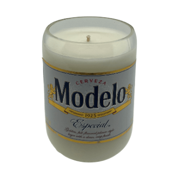 The Recycled Especial Beer Candle is a white, hand-poured candle in a glass made from a recycled Modelo Especial bottle with its original label—an eco-friendly, sustainable choice.