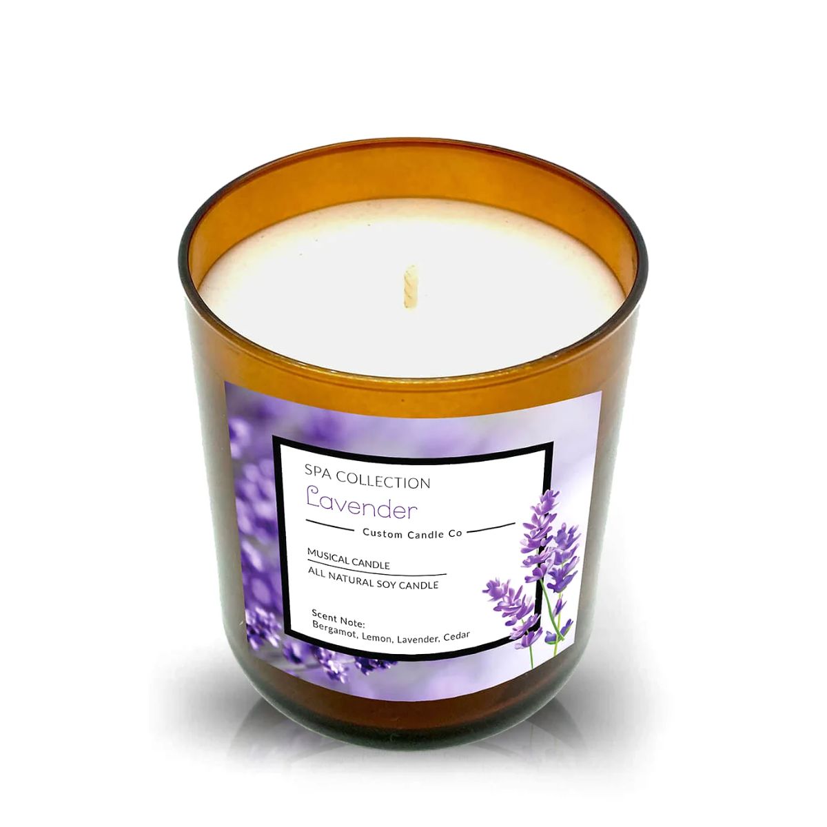 The Musical Spa Lavender Candle is a brown glass jar with white wax and a single wick, labeled "Lavender." Scents of bergamot, lemon, lavender, and cedar create a relaxing spa atmosphere.