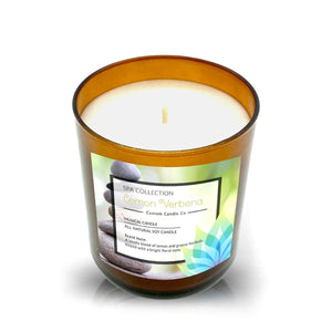 The Musical Spa Lemon Verbena Candle features a brown glass jar with spa stones and leaves on the label, a single wick, and white soy scented wax from the "Lemon Verbena" collection.