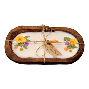 The Orange Floral Wood Candle—Floral Scented—is a natural soy wax candle with pressed flowers, displayed in an oval wooden tray. Finished with twine and a tag, it creates a charming rustic centerpiece.