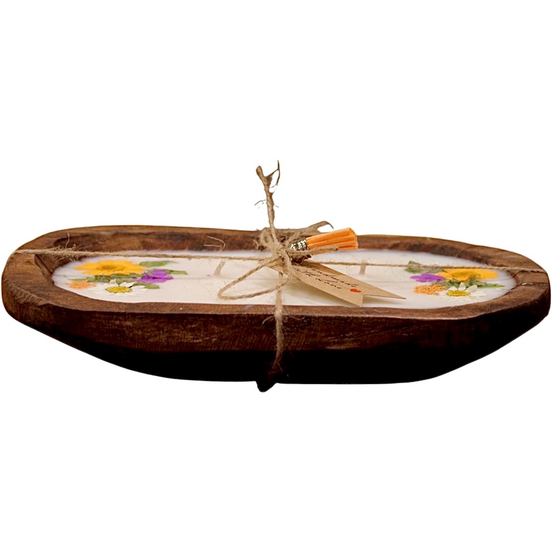 The Orange Floral Wood Candle – Floral Scented features a wooden tray with a white base, colorful pressed flowers, twine, and a small tag, making it a charming rustic centerpiece.