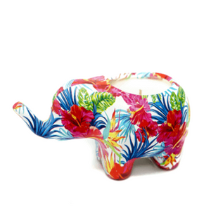 Pasha the Ceramic Elephant Candle features a vibrant tropical floral pattern and is ideal for showcasing an all-natural soy citronella candle, adding charm to your space.