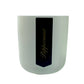 The Holiday Scented Boxed Candle – Peppermint Scent comes in a white cylindrical container with a black label featuring "Peppermint" in gold cursive, and is made with natural soy wax for a fresh peppermint fragrance.