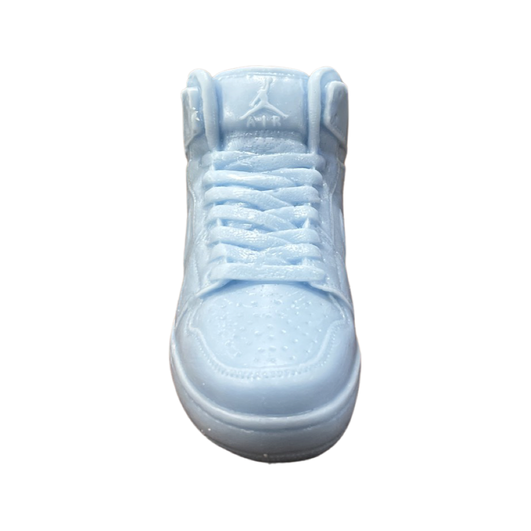 The AJ-1 Baby Blue Sneaker Candle – Large (On Backorder) is hand poured, shaped like an athletic shoe, and displayed from a front view on a white background.