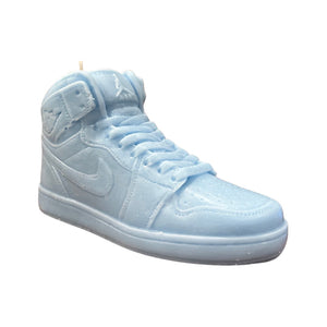 The AJ-1 Baby Blue Sneaker Candle – Large (On Backorder), hand poured and shaped like a high-top sneaker in light blue, is displayed against a plain white background.