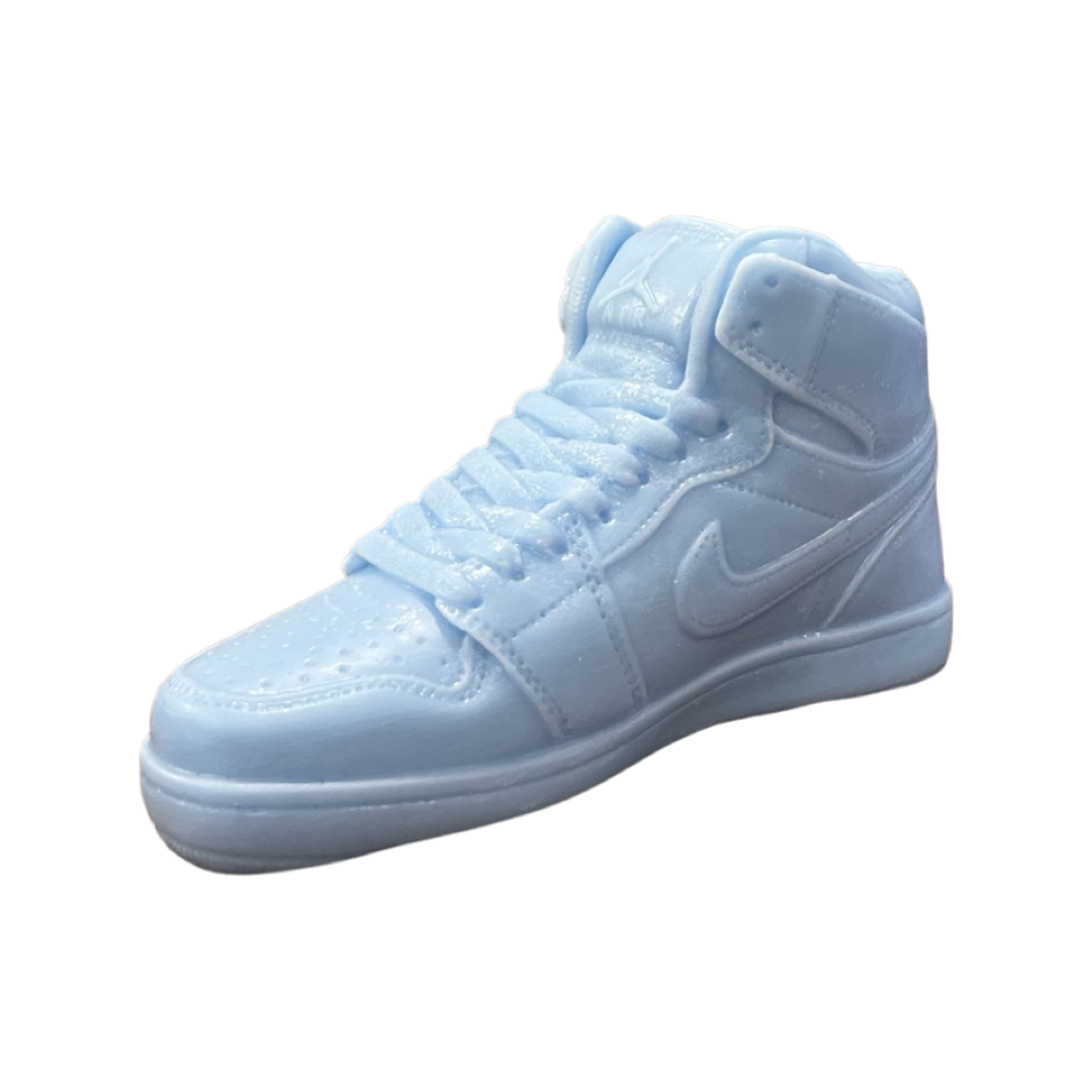 The AJ-1 Baby Blue Sneaker Candle – Large (On Backorder) is a hand-poured candle in light blue, shaped like a Nike-inspired high-top shoe and displayed on a white background.