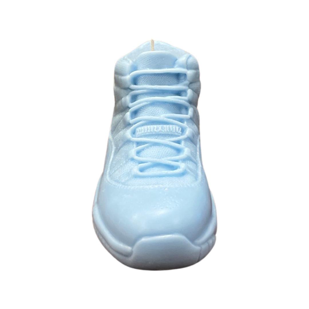 Front view of the AJ-11 Baby Blue Hightop Sneaker Candle – Large (On Backorder), a hand-poured candle shaped like a stylish hightop sneaker, shown against a white background.