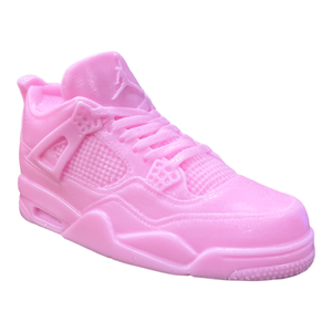 The AJ-4 Baby Pink Sneaker Candle – XL (On Backorder) is a baby pink candle shaped like an athletic shoe, shown against a plain white background.