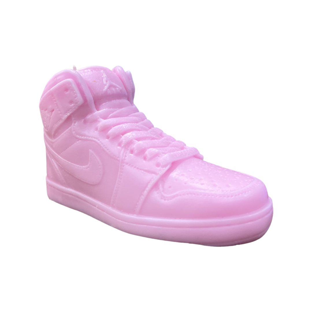 The AJ-1 Baby Pink Sneaker Candle – Large (On Backorder) is a hand-poured candle shaped like a high-top sneaker, featuring detailed craftsmanship in soft pink, and photographed on a white background for a playful, stylish look.