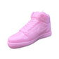 The AJ-1 Baby Pink Sneaker Candle – Large (On Backorder) is a hand-poured candle with detailed laces and a textured surface, designed to resemble a classic high-top athletic shoe and shown on a white background.