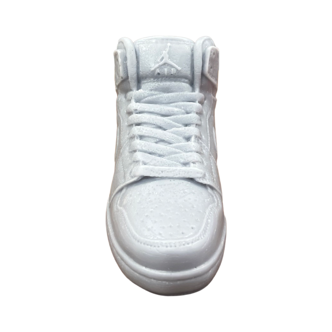 The AJ-1 Gray Sneaker Candle – Large (On Backorder) is a hand poured candle that replicates a gray sneaker's front view with laces, textured details, and logo on the tongue—perfect for a stylish display against any background.