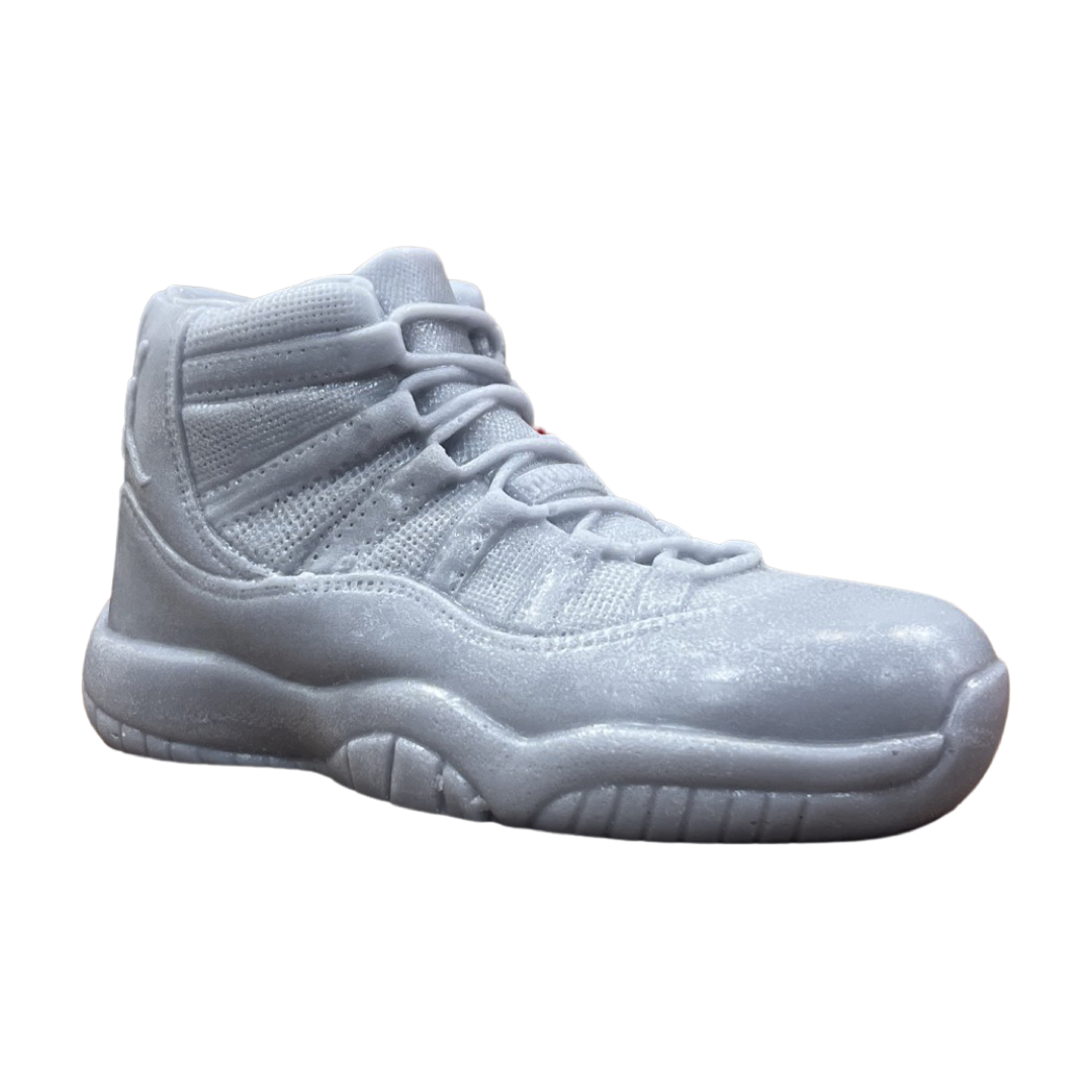 The AJ-11 Gray Hightop Sneaker Candle – Large (currently on backorder) is hand poured to resemble an athletic shoe and is displayed against a white background.