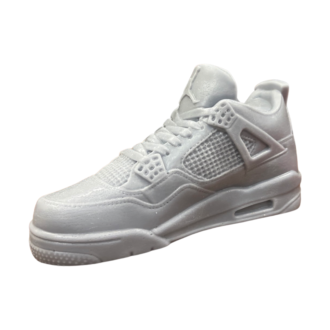 The AJ-4 Gray Sneaker Candle – XL (On Backorder) is a detailed gray candle shaped like a classic basketball shoe, hand poured and infused with the invigorating scent of Black Ice fragrance, shown on a plain white background.