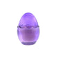 The Purple Glass Easter Egg is a translucent purple glass candle shaped like an egg with a zigzag pattern, crafted from natural wax to add charm to any space.