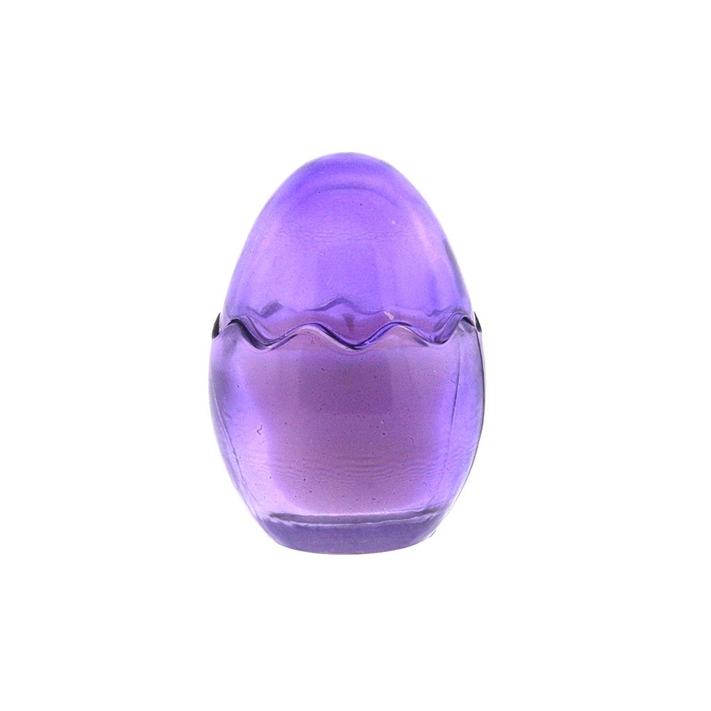 The Purple Glass Easter Egg is a translucent purple glass candle shaped like an egg with a zigzag pattern, crafted from natural wax to add charm to any space.