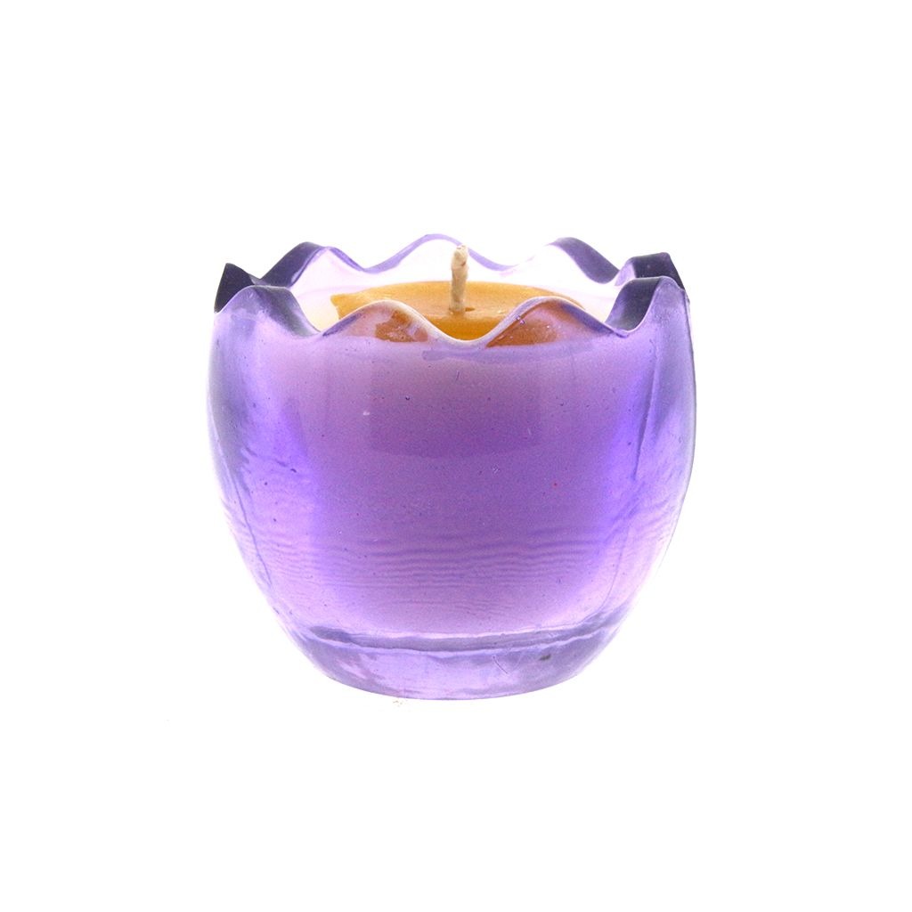The Purple Glass Easter Egg w/ Yoke features a wavy-rimmed purple glass holder cradling an egg-shaped natural wax candle, displayed on a white background.