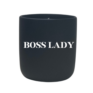 The Quoted - "Boss Lady" Candle features a black jar with "BOSS LADY" in bold white lettering, crafted from all-natural wax to empower and uplift your space.
