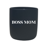 The Quoted "Boss Mom" Candle is made from all natural wax and displays “BOSS MOM” in bold white letters on its sleek black front.