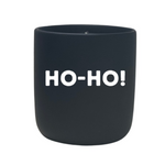 The Quoted - "Ho-Ho!" Candle is a black custom candle holder with "HO-HO!" in bold white letters, ideal for displaying your favorite natural wax or feng shui candle.