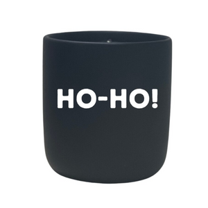 The Quoted - "Ho-Ho!" Candle is a black custom candle holder with "HO-HO!" in bold white letters, ideal for displaying your favorite natural wax or feng shui candle.