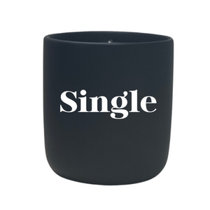 The Quoted - "Single" Candle is a black holder with "Single" in bold white print, designed to perfectly hold your favorite all natural wax or custom candle.