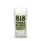 The Recycled Azul Agave Blanco Tequila Candle, crafted from a square glass bottle with "818 Tequila Blanco" labeling and black text on yellow, adds the essence of agave lime to your space.