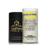 A Recycled Citron Vodka Candle in frosted glass sits beside a sleek black Custom Candle Co. container with gold lettering, both highlighting elegant artisanal candles made from recycled bottles.