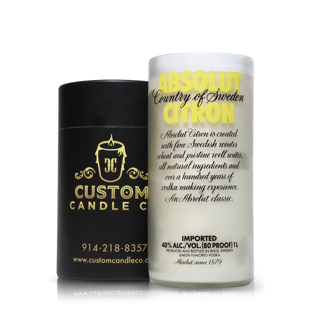 A Recycled Citron Vodka Candle in frosted glass sits beside a sleek black Custom Candle Co. container with gold lettering, both highlighting elegant artisanal candles made from recycled bottles.