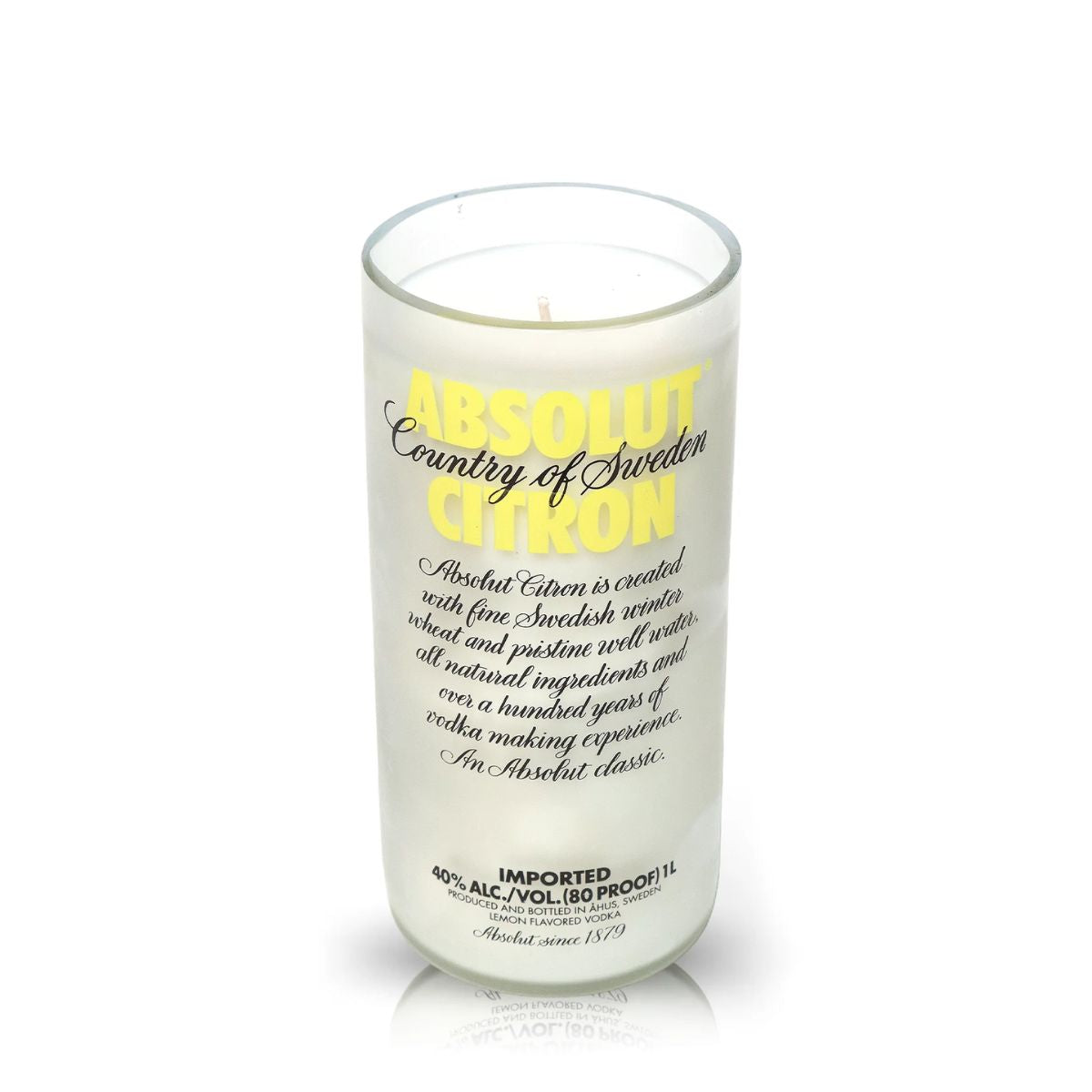 The Recycled Citron Vodka Candle is a frosted glass candle made from a recycled bottle, featuring label text about its eco-friendly creation and 40% alcohol content—an ideal pick for fans of distinctive, sustainable candles.