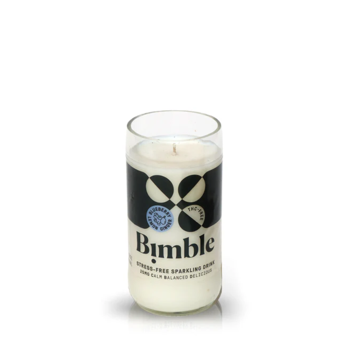 The Recycled Sparkling Water Candle is poured into an empty Bimble glass with black and white branding—a unique, eco-friendly candle perfect for any space.