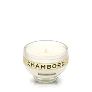 A Recycled Loire Valley Liqueur Candle in a glass holder labeled "CHAMBORD," made from upcycled liqueur bottles with a white candle inside, is displayed against a plain white background.