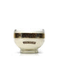 The Recycled Loire Valley Liqueur Candle features a clear glass bowl made from upcycled bottles, showcasing a gold "Chambord" label and "All-Natural Raspberry Liqueur" tag—ideal for unique candle creations or displaying scented candles.
