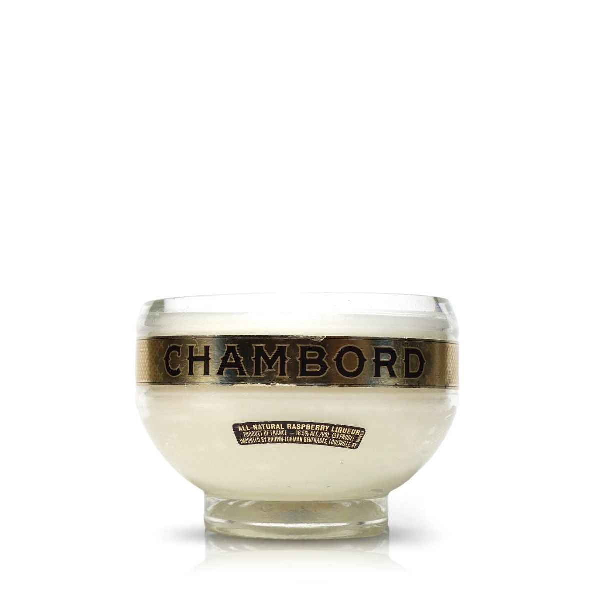 The Recycled Loire Valley Liqueur Candle features a clear glass bowl made from upcycled bottles, showcasing a gold "Chambord" label and "All-Natural Raspberry Liqueur" tag—ideal for unique candle creations or displaying scented candles.